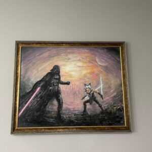 A framed Darth Vader and Luke Skywalker painting in a customer's home